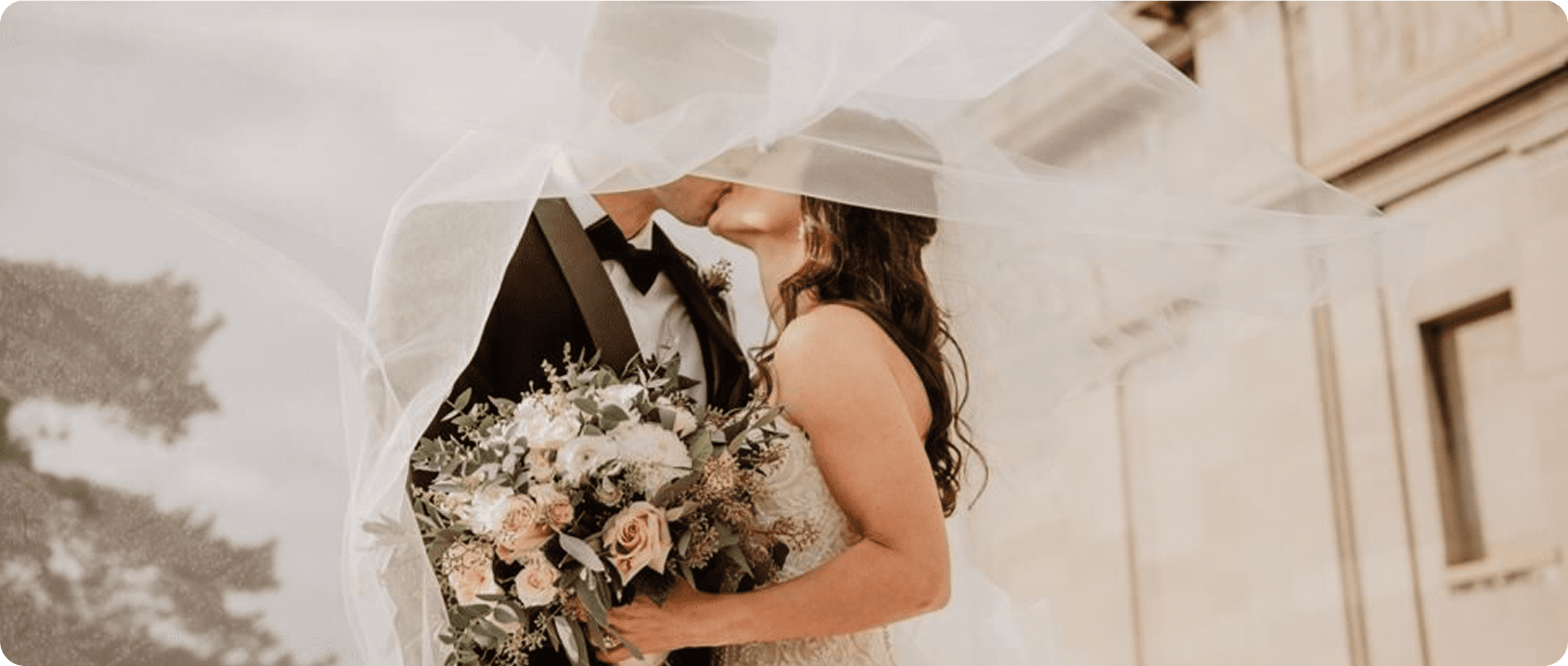 Romantic wedding couple with bouquet
