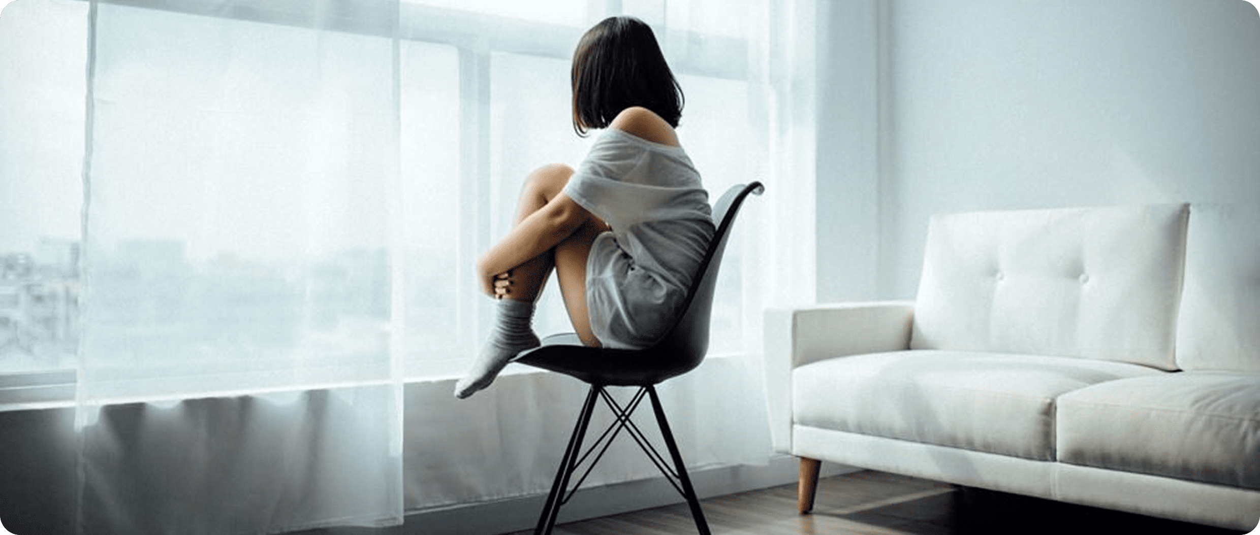 Contemplative scene with chair and sofa