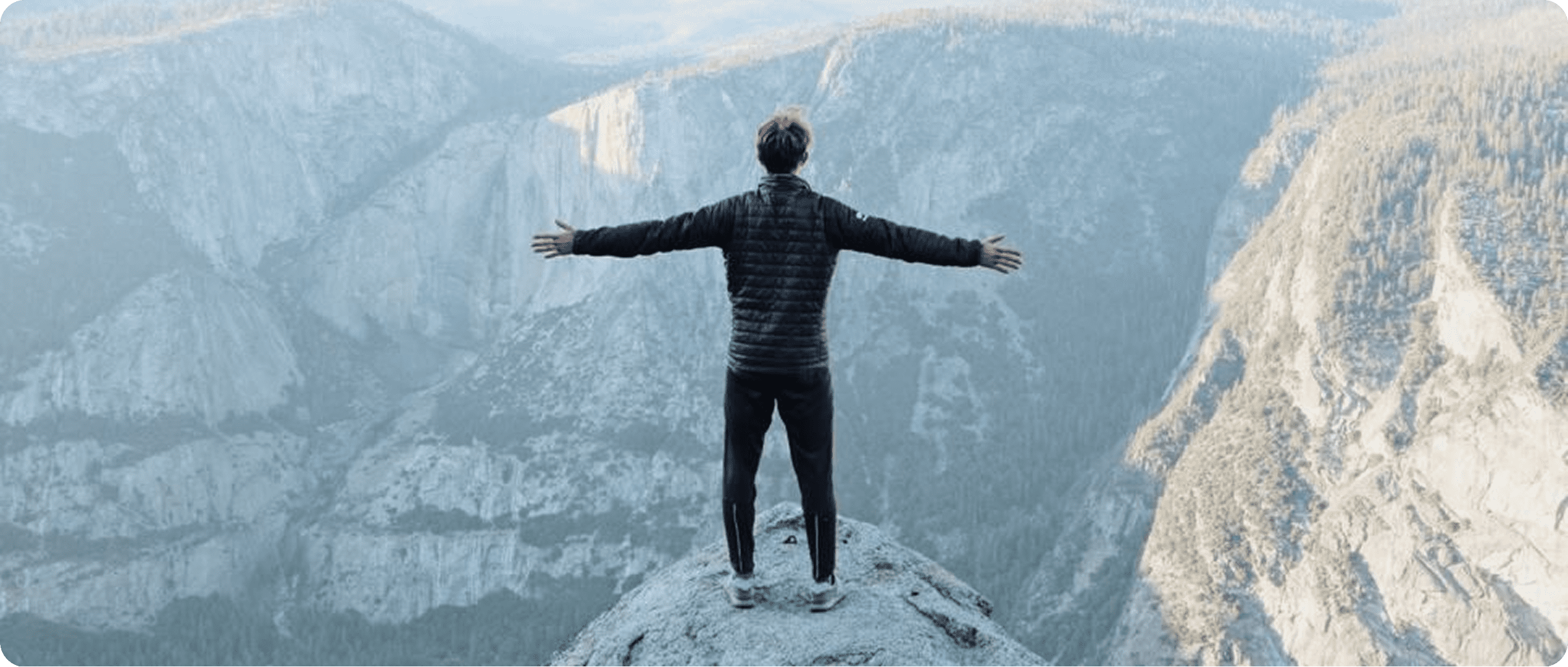Person standing on cliff edge