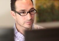Man focused on computer screen